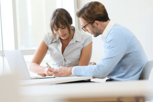 man and woman working on something together