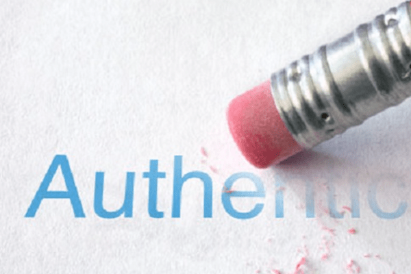 the word authenticity being erased by a pencil eraser