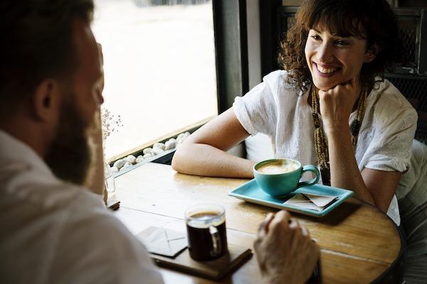 man and woman sharing coffee and conversation