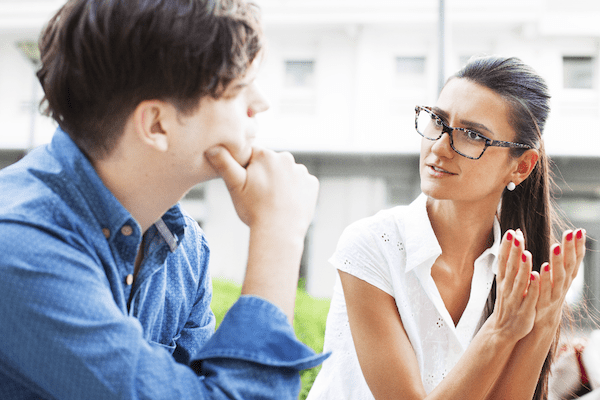 man and woman having a serious talk with man listening intently and openly