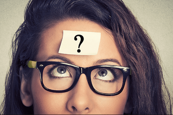 woman with a sticky note on her forehead with a question mark
