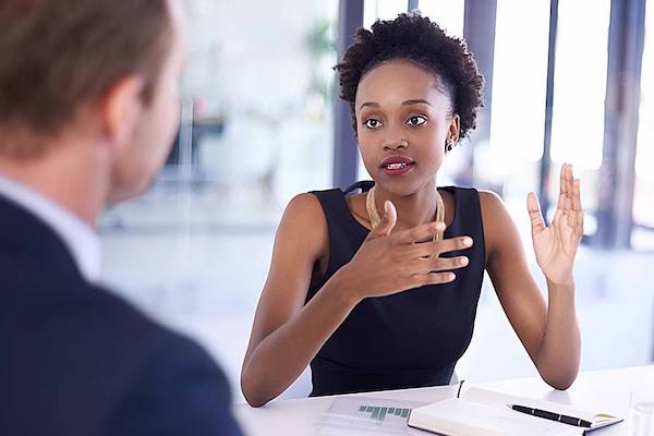 Women meeting with a man in a conference room