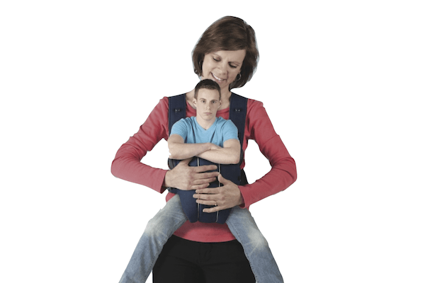 grown woman with grown man in baby carrier