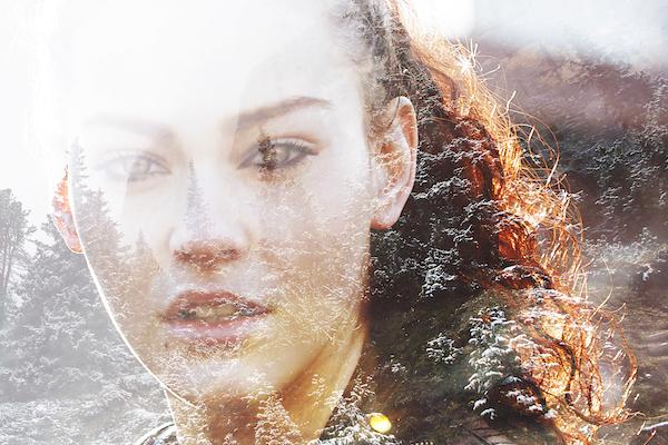 Double exposure of girl with gorgeous eyes in winterscape