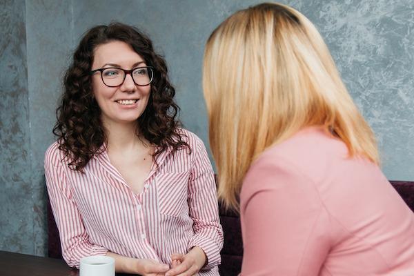 casual woman talking over coffee