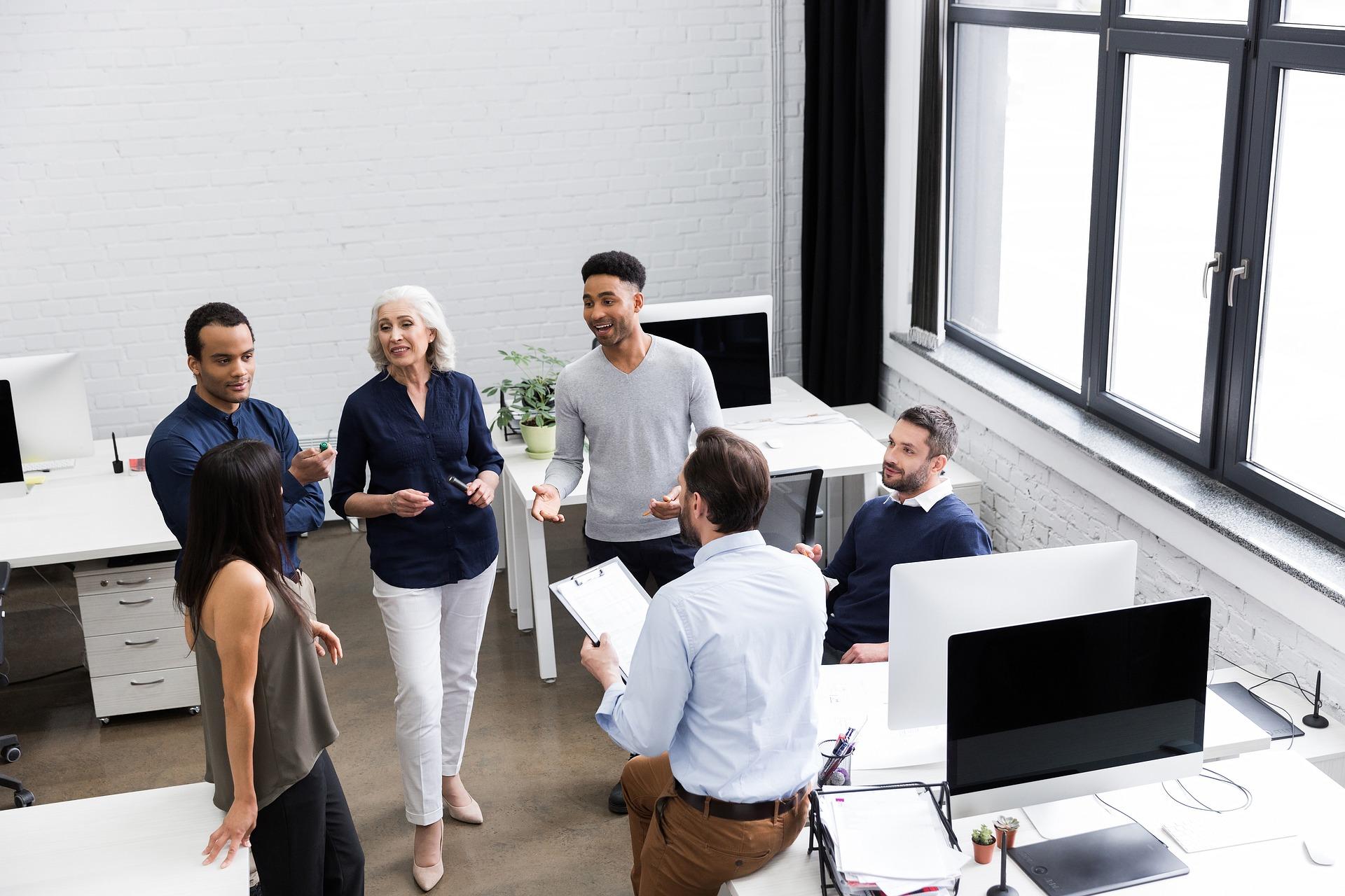 group of professionals casually congregating to talk about something