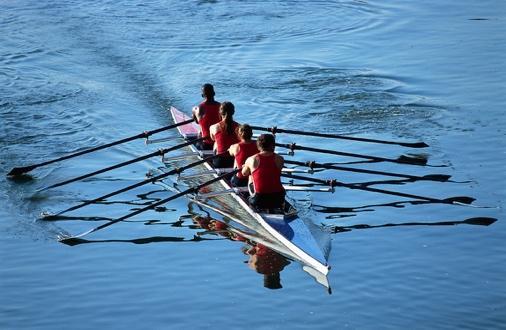 people rowing in a boat