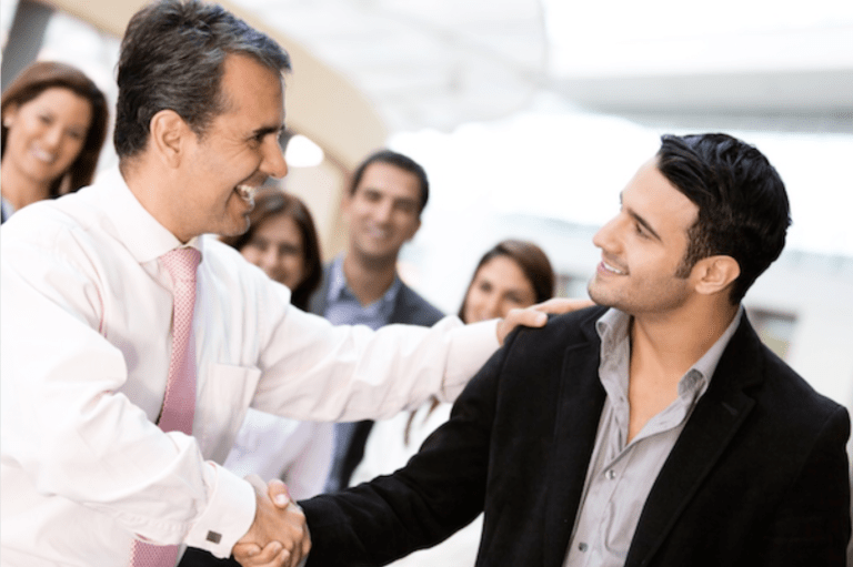 Two men greeting with a handshake