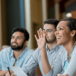 3 people at work looking happy and receptive and awestruck