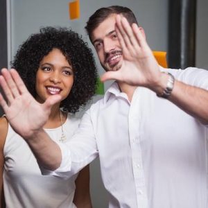 Man framing out a vision in the air to a woman