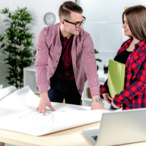 man and woman discussing blueprint